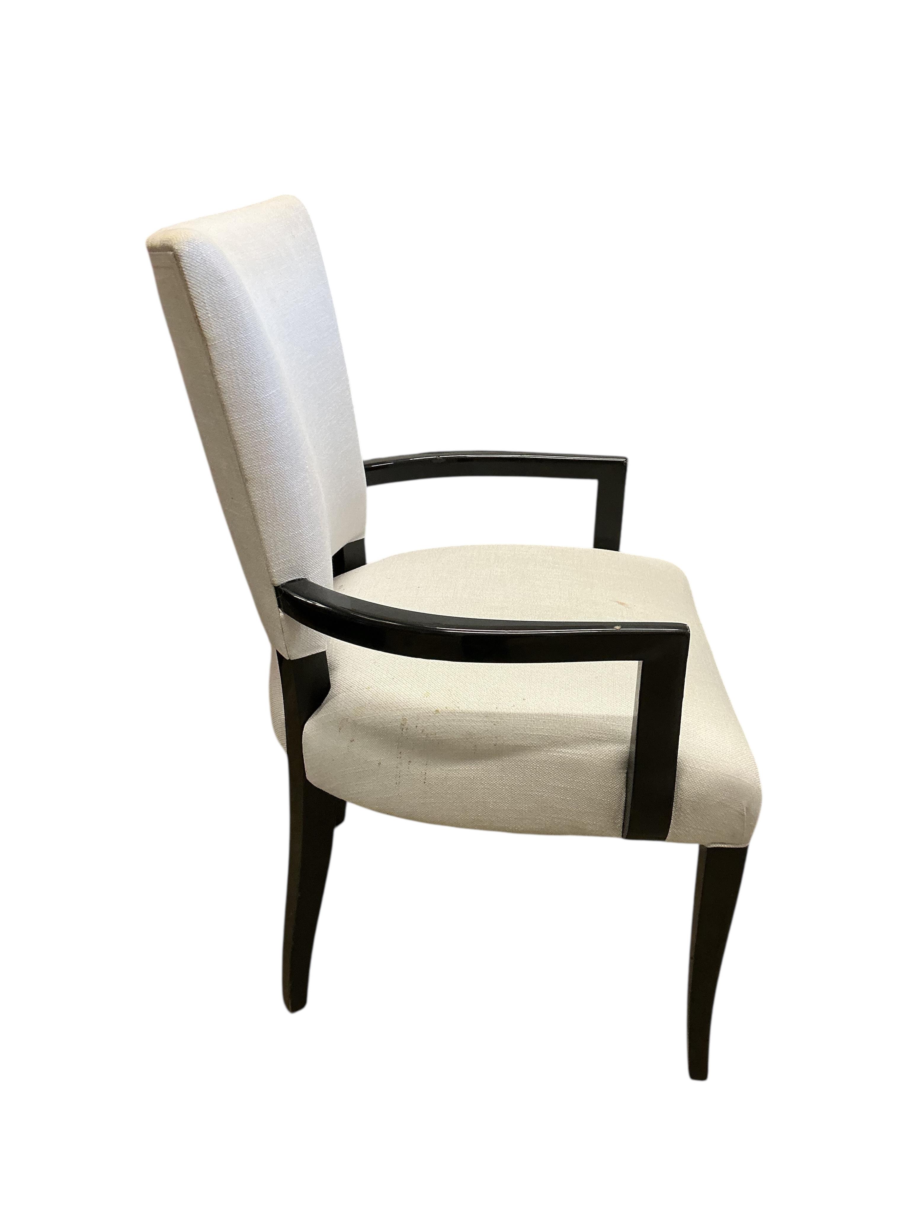 Seven contemporary ebonised and grey fabric elbow chairs, five with arms